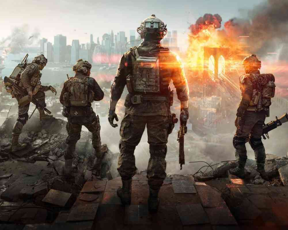 Grafika z gry Battlefield 6 – czterech żołnierzy w nowoczesnym oporządzeniu stoi na gruzach, patrząc w stronę płonącego mostu w mieście, gdzie w tle widać eksplozję i panoramę wieżowców.