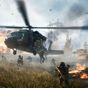 Na obrazie widać scenę akcji z gry "Battlefield 6" – żołnierze wyskakują z helikoptera na pole bitwy, wokół nich wybuchają eksplozje i widać dym unoszący się nad zniszczonym terenem. W tle znajdują się pojazdy wojskowe i płonące obiekty.