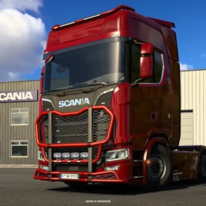 Na ilustracji z gry **Euro Truck Simulator 2** widać czerwoną ciężarówkę marki Scania zaparkowaną przed budynkiem serwisowym z logo producenta. Pojazd ma masywny zderzak ochronny i charakterystyczne detale karoserii, a w tle widać niebo z lekkim zachmurzeniem.