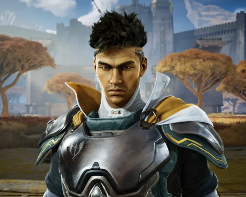Postać męskiego bohatera z gry fantasy/sci-fi w futurystycznej zbroi, stojąca na tle monumentalnej fortecy i jesiennego krajobrazu. Grafika promocyjna gry Highguard przedstawiająca grywalną postać w świecie fantasy