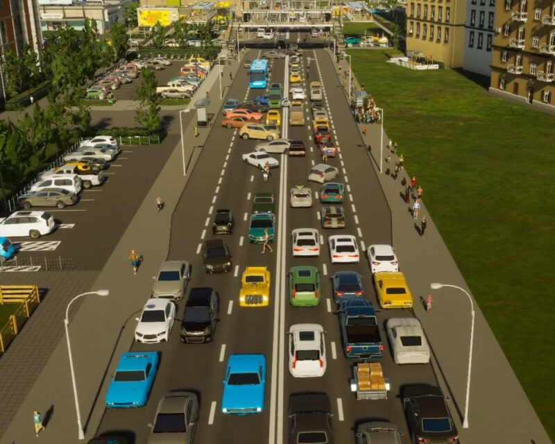 Zrzut ekranu z gry Cities: Skylines 2. Obrazek prezentuje zatłoczoną drogę, na której pojazdy, jak i piesi zachowują się absurdalnie, albo zawracając w korku, albo przebiegając przez jezdnię między samochodami. To obrazuje chaos, jaki panuje w grze.