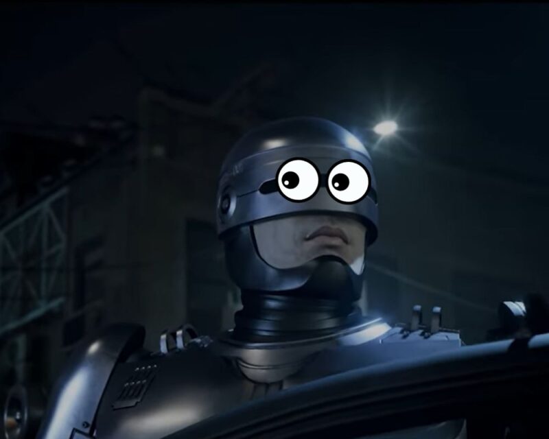 Grafika prezentuje przerobiony zrzut ekranu z gry RoboCop: Rogue City. Tytułowy bohater wysiada z pojazdu w nocy. Jest duże zbliżenie na jego twarz. W miejscu wizjera wklejone zostały komiksowe oczy, wyrażające niepewność i zaskoczenie.