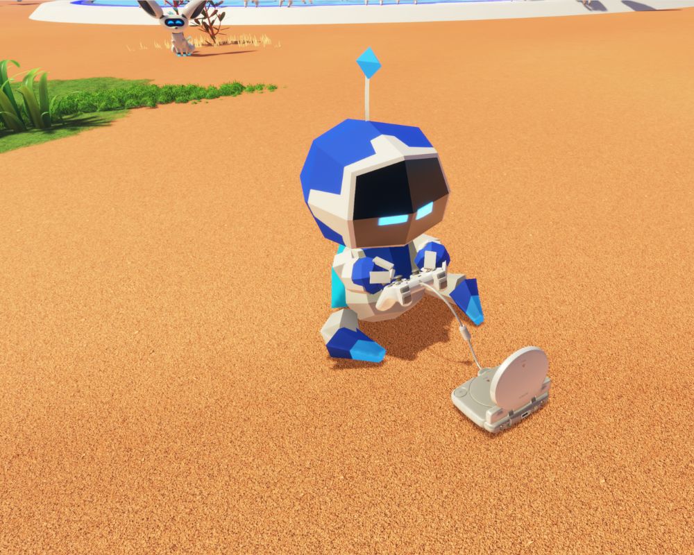 Robot z gry Astro Bot siedzi na piasku i gra na przenośnej konsoli.