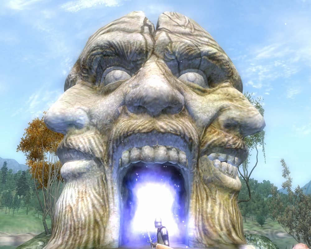 Brama do Shivering Isles z gry Oblivion. Ogromna kamienna rzeźba przedstawiająca trzy połączone twarze z otwartymi ustami tworzącymi świecące, magiczne przejście. Przed portalem stoi mała postać, a wokół widoczny jest zielony krajobraz z drzewami i błękitnym niebem. Scena utrzymana jest w fantastycznym klimacie przygody i magii.