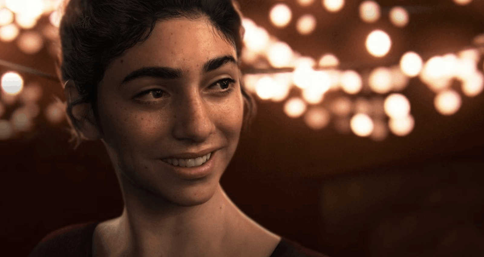 dina the last of us Bliski kadr na twarz Diny z gry The Last of Us Part II. Dziewczyna ma ciemne, spięte włosy, wyraziste brwi, piegi na policzkach i uśmiecha się, patrząc w prawą stronę. Tło jest ciemne i mocno rozmyte, z widocznymi licznymi, ciepłymi punktami świetlnymi (efekt bokeh), sugerującymi wiszące girlandy żarówkowe na zabawie lub festynie.
