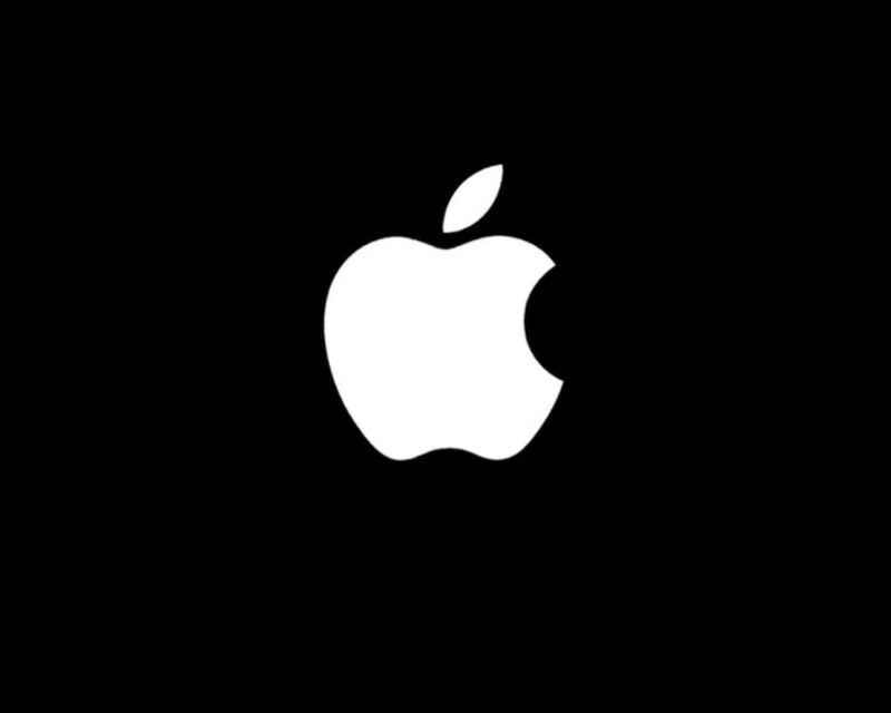 Logo Apple – białe logo z charakterystycznym nadgryzionym jabłkiem na czarnym tle.
